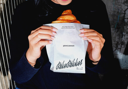 Holding Bakery Bag Mockup