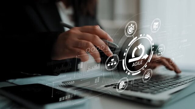 Business professional engaging with technology to implement agile methodology in modern workplace, showcasing innovation and productivity enhancement. Entropy.