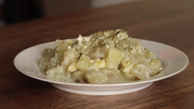 Traditional Peruvian chu&ntilde;o served with cheese and boiled egg