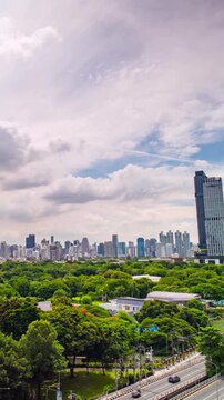 Bangkok central business district time-lapse on a cloudy day, modern skyscrapers under changing sky.