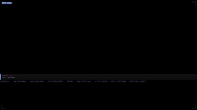 A dark computer screen with a top status bar and bottom menu featuring multiple navigation options displayed on a black background