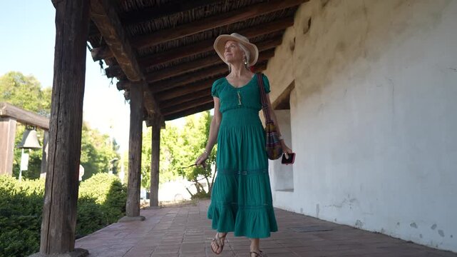 Mature woman enjoys a walk in the historic Mission church San Francisco Solano de Sonoma built in 1823 in Sonoma California