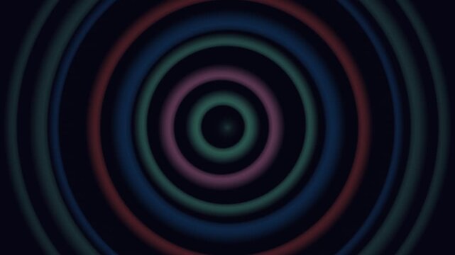 Dark concentric rings glow with shifting colors from the center outward in a hypnotic pattern.