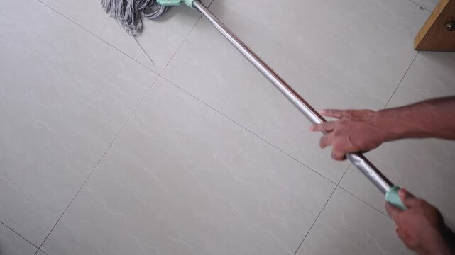 Cleaning a floor with a mop at home