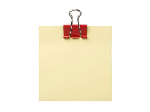 Yellow sticky note with red binder clip isolated on transparent background.