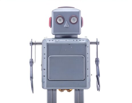 Vintage metal robot toy with red ears isolated on white studio background