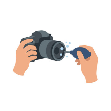 Hands cleaning camera lens with air blower, dust removal, photography equipment maintenance