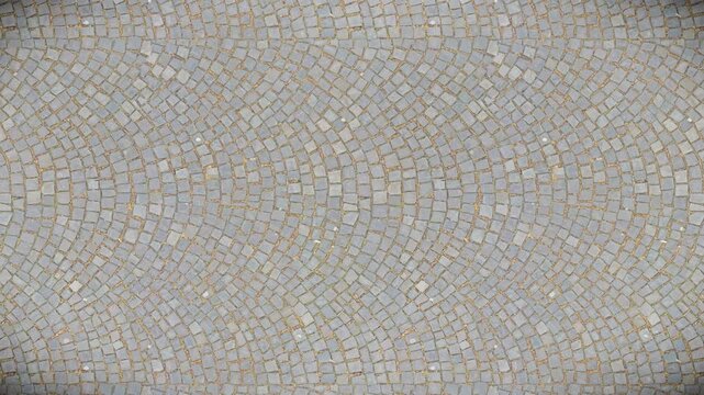 Rustic grey cobblestone paving forms a curved seamless loop texture background.