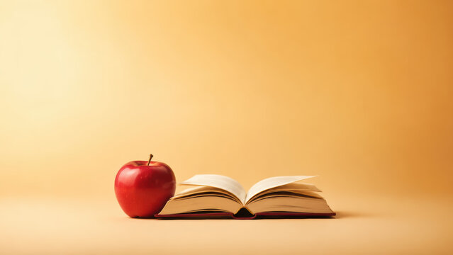 Apple and a book in a clean contemporary commercial composition