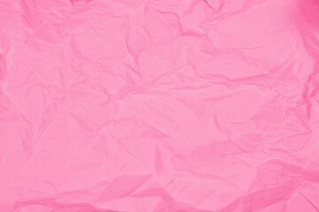 Fototapeta premium Crumpled pink paper texture background with abstract folds and wrinkles