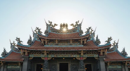 Obraz premium Ornate Traditional Chinese Temple Roof with Sculptures Against a Bright Sky.