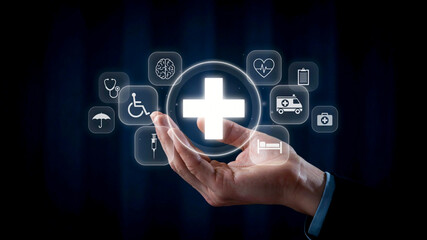 Fototapeta premium Healthcare concepts and medical icons illuminated with a glowing white cross symbol above an open palm