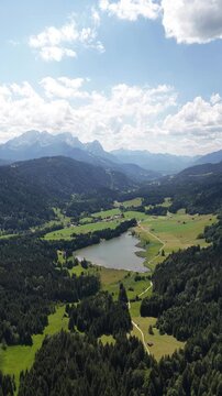 Lake Gerold Bavaria, Germany Karwendel Mountains of the Bavarian Alps aerial view vertical video