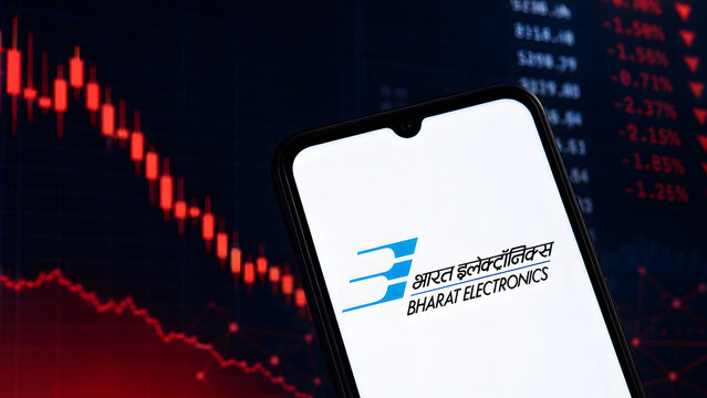 Bharat Electronics logo shown on a smartphone before falling red stock charts, illustrating bearish sentiment and investment risk.
