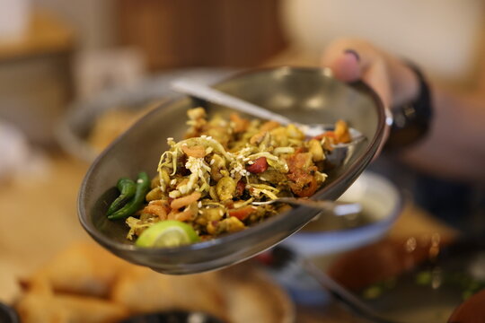 Traditional Burmese Tea Leaf Salad Served in a Ceramic Bowl