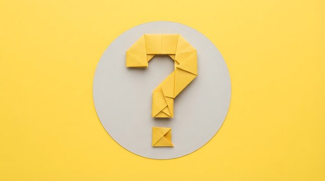 Yellow paper origami question mark symbol