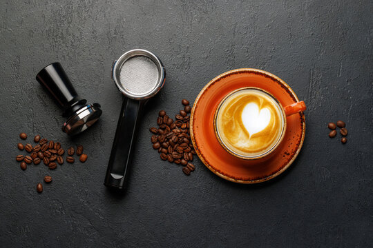 Espresso preparation tools and coffee beans flat lay composition