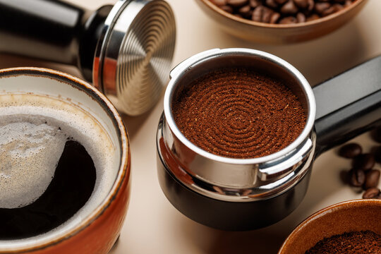 Close up of fresh ground coffee in portafilter for espresso machine