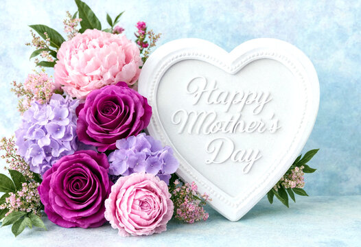 Beautiful heartshaped decoration with fresh flowers for happy mothers day celebration greeting card