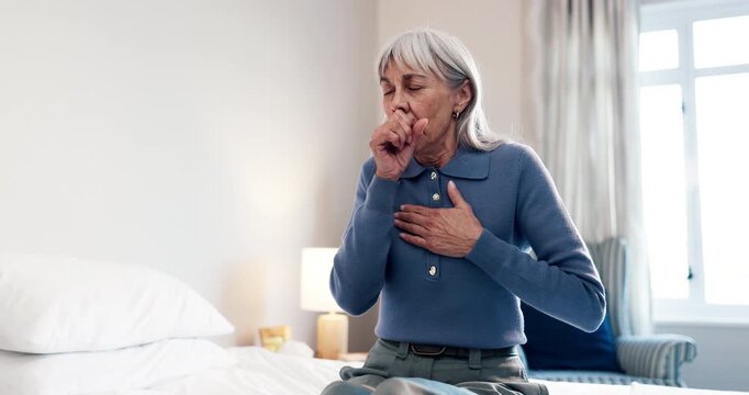 Cough, sick and senior woman on bed in home with allergies, chest infection or sore throat. Illness, retirement and elderly female person with tuberculosis, cold or flu symptoms in bedroom of house