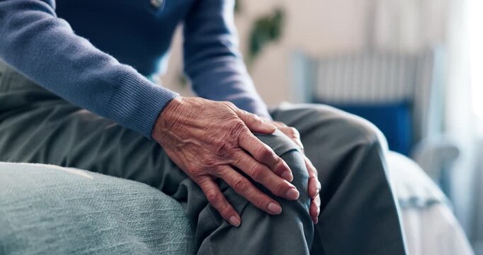 Hands, knee pain and senior woman on bed for joint ache, arthritis or orthopedic injury in home. Elderly person, medical issue or tension with osteoporosis, fibromyalgia or massage in retirement