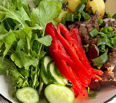 Colorful Harvard plate with chicken liver protein and fresh vegetables. Healthy eating diet.