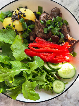 Colorful Harvard plate with chicken liver protein and fresh vegetables. Healthy eating diet.