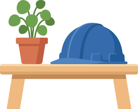 Blue hard hat and potted plant on wooden table