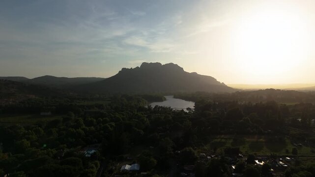 Panoramic drone shot of the Rocher de Roquebrune mountain, hazy evening in France