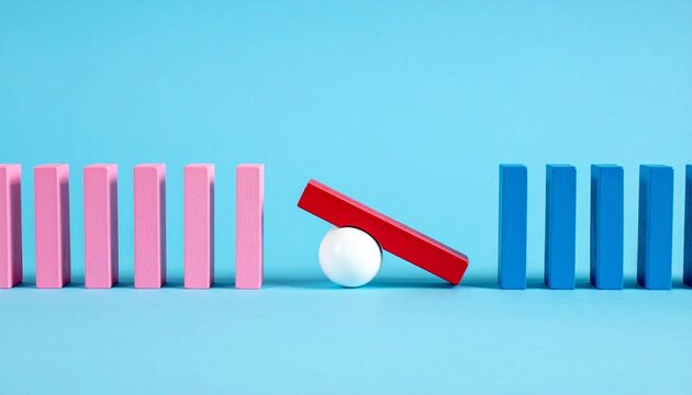 Color blocks interrupted by white ball disrupting domino sequence