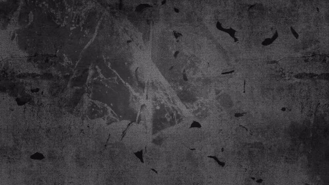 Abstract dark gray grunge concrete wall texture background with subtle particle overlay.