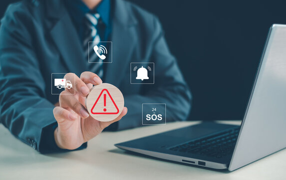Business professional demonstrating a 24-hour SOS emergency support system with alert notification, emergency response, customer service, ambulance assistance, and crisis management technology.