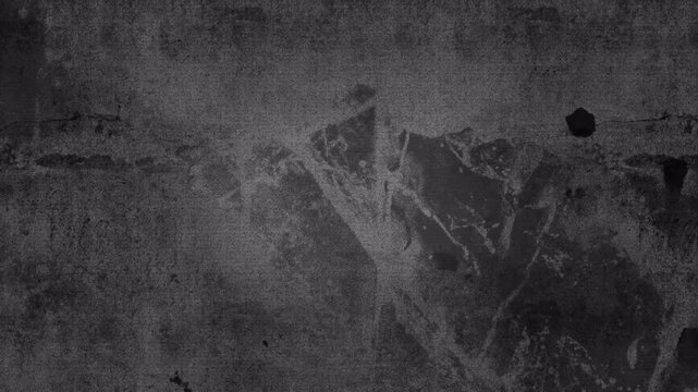 Abstract dark grey textured surface with subtle grunge pattern.