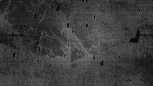 Abstract dark grey textured surface with subtle scratches and vintage film grain effect.