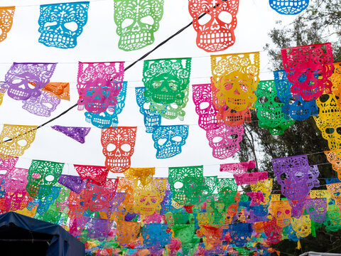 Colorful Sugar Skull Papel Picado Decorations Celebrating Day of the Dead in Mexico
