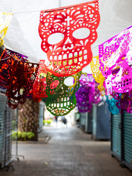 Colorful Sugar Skull Papel Picado Decorations Celebrating Day of the Dead in Mexico