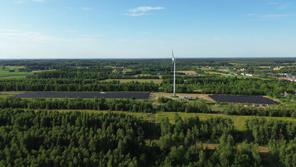 Fototapeta premium Renewable power source with wind turbine and solar panels
