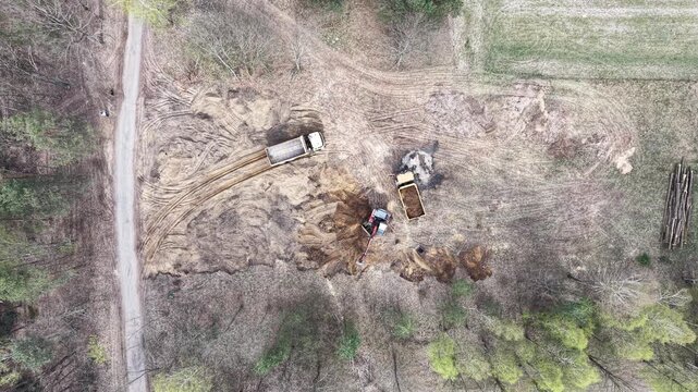 Top down view of construction machinery shaping rural land