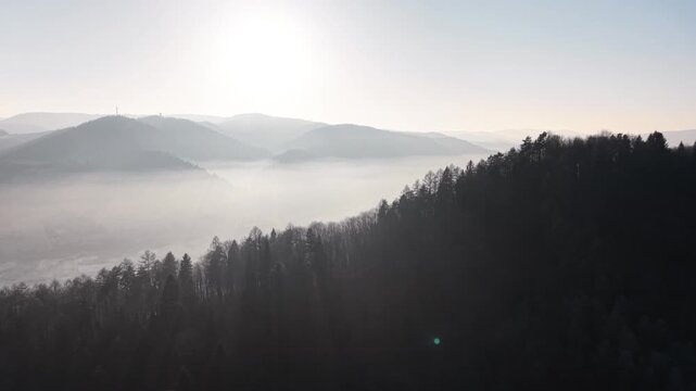 Beautiful foggy hills with soft morning sunlight