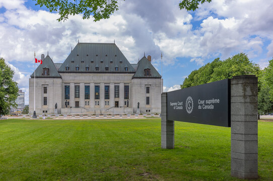 Ottawa, Ontario, Canada. July 28, 2026. Wide angle view of Supreme Court of Canada exterior building and official entrance sign on lawn.