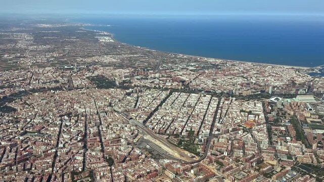 Aerilal spinning view taken from an airplane cockpit doing a left furn over Valencia city, with a view of the north coast and Mediterranean Sea. 2000m high 4K shot.