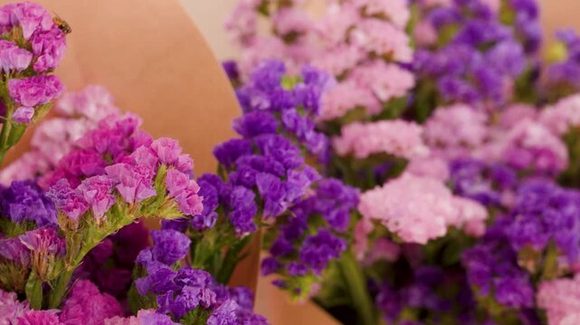 Purple and Pink Statice Flower Bouquets in Brown Paper Wrap