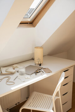 Cozy Attic Desk Setup Under Skylight Window