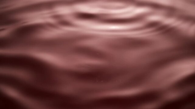 Abstract macro shot of dark red liquid ripples and waves moving across a smooth surface with dramatic cinematic lighting and soft bokeh highlights in a dark moody environment