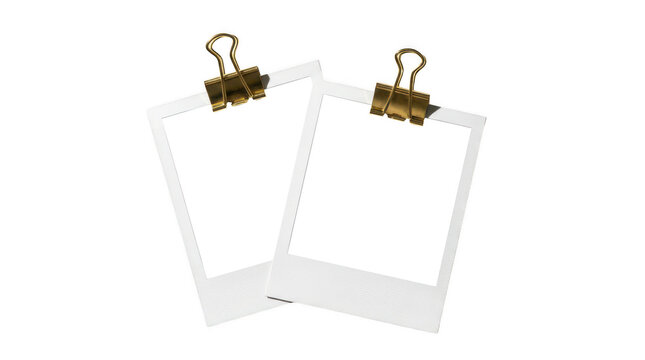 Two blank instant photo frames with golden binder clips isolated on transparent background