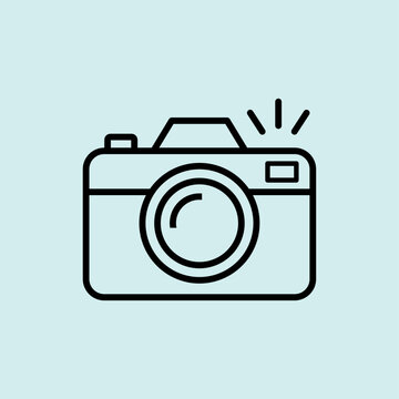 Vector line icon of a digital camera with flash. Symbol for travel photography, capturing memories, and sightseeing.
