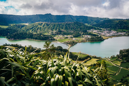 Scenic viewpoint overlooking twin caldera lakes and a village