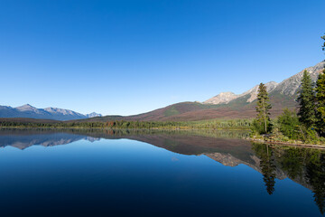 Fototapeta premium Reflections of Pyramid Lake in Jasper National Park, Alberta, Canada