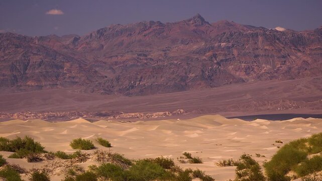 Colored mountains and yellow sand in death valley