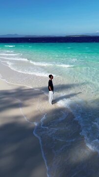 Man Standing on Tropical Beach